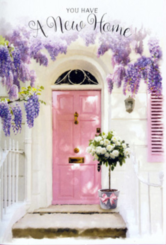 A sunlit doorway in Oxted is styled to feel like the first page of a new chapter, its every element carefully composed to welcome someone home. The soft pink front door, painted in a soothing, chalky pastel, glows gently against the crisp, whitewashed exterior, much like the quietly elegant houses tucked along roads leading out toward Limpsfield. A matching shutter is propped open to catch the light, so that the whole façade appears airy and inviting. Above, generous garlands of wisteria trail down in cascading curtains of lavender and lilac, the clustered blooms suggesting a perfume so sweet you can almost imagine it drifting across the pavement. At the threshold sits a simple yet stylish grey bucket, placed with the natural ease of a same-day delivery dropped off by a local Oxted florist. It is brimming with creamy white roses, their rounded heads fully open and layered, brushed at the edges with warmth and framed by soft green foliage. The leaves break up the creamy tones, adding a garden-fresh contrast and hinting at the countryside around Oxted. A satin-finish pink ribbon is tied around the bucket, its gentle sheen catching the light and echoing the tone of the door. The whole scene suggests the emotions of moving into a new address-tiny flutters of nervousness balanced by optimism and the comfort of being greeted by flowers. You can almost hear the faint sounds of the town in the distance, while the doorstep itself feels like a quiet, private stage set for congratulations, housewarming wishes, and the promise that this new house will soon become a cherished home.